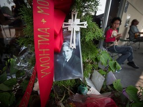 A photograph of a man, that media reports have identified as Michael Page-Vincelli, is seen at a makeshift memorial outside a Starbucks in Burnaby, B.C., on Friday August 11, 2017. About a month ago, a young man died after an altercation inside a Metro Vancouver Starbucks that a witness says left him unconscious and bleeding profusely on the floor. THE CANADIAN PRESS/Darryl Dyck