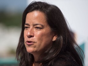 Justice Minister Jody Wilson-Raybould introduces Agriculture Minister Lawrence MacAulay during a news conference in Vancouver, B.C., on Tuesday August 15, 2017. MacAulay announced that the Canadian Food Inspection Agency will lead two projects that use new DNA-based technologies to reduce quarantine testing time of fruit plants being imported and exported. THE CANADIAN PRESS/Darryl Dyck
