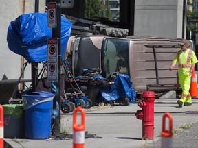A man walks through a film set for the movie "Deadpool 2" in Vancouver, B.C., on Tuesday August 15, 2017. Production was halted after the death of a stuntwoman at a different filming location on Monday. The B.C. Coroners Service has identified the stuntwoman killed while she was working on the set as 40-year-old SJ Harris, a resident of New York City. THE CANADIAN PRESS/Darryl Dyck