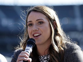 In this Tuesday, Aug. 15, 2017, photo, Amanda Hopkins talks on a panel on women in baseball before a baseball game between the Seattle Mariners and the Baltimore Orioles in Seattle. Hopkins, 24, is about to complete her second year as an area scout for the Mariners, a position that has made her a part of baseball history.