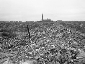 File-This file photo from 1945 shows the remains of the Warsaw ghetto, which the German SS dynamited to the ground. A Polish ruling party official said Wednesday that Poland is considering demanding reparations from Germany for the massive losses inflicted on Poland during World War II. Ruling party leader Jaroslaw Kaczynski recently said Poland planned a "counter-offensive" against Germany, accusing the neighbor of avoiding responsibility for its war-era crimes. (AP Photo/B.I. Sanders)