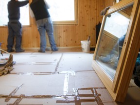 Workers installing new windows