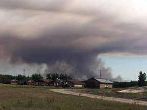 A wildfire near Poplar River First Nation. In the summer, there are no roads out of town; only the airport.