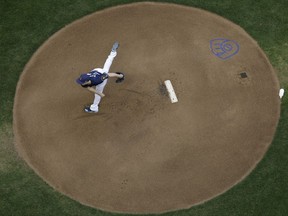 Milwaukee Brewers starting pitcher Zach Davies throws during the first inning of a baseball game against the Pittsburgh Pirates Tuesday, Aug. 15, 2017, in Milwaukee. (AP Photo/Morry Gash)