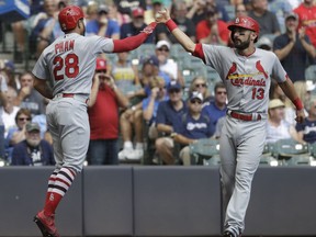 St. Louis Cardinals' Tommy Pham is congratulated by Matt Carpenter after hitting a two-run home run during the first inning of a baseball game against the Milwaukee Brewers Wednesday, Aug. 30, 2017, in Milwaukee. (AP Photo/Morry Gash)