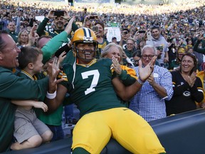 Green Bay Packers' Brett Hundley celebrates his touchdown run with fans during the first half of a preseason NFL football game against the Los Angeles Rams Thursday, Aug. 31, 2017, in Green Bay, Wis. (AP Photo/Matt Ludtke)