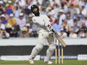 England's Moeen Ali avoids a bouncer from South Africa's Kagiso Rabada, during day two of the Fourth Test at Emirates Old Trafford in Manchester, England, Saturday August 5, 2017. (Anthony Devlin/PA via AP)