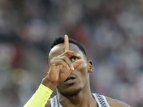 Botswana's Isaac Makwala gestures after winning a Men's 400m semifinal during the World Athletics Championships in London Sunday, Aug. 6, 2017. (AP Photo/David J. Phillip)