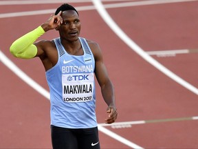 Botswana's Isaac Makwala reacts after winning his heat of the Men's 400 meters during the World Athletics Championships in London Sunday, Aug. 6, 2017. (AP Photo/Martin Meissner)