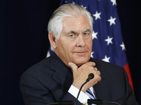 FILE - In this Aug. 17, 2017 file photo, Secretary of State Rex Tillerson listens to a question during a news conference at the State Department in Washington. The State Department says at least one American was killed and one injured in the attacks in Barcelona and Cambrils, Spain. In remarks to State Department staff on Friday, Aug. 17, 2017, Tillerson confirmed the death and expressed condolences to the victim's family. He said diplomats from the U.S. consulate in Barcelona are working with local authorities to identify victims and provide assistance to other Americans in need. (AP Photo/Jacquelyn Martin, File)