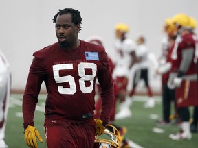 In this photo taken May 24, 2017, Washington Redskins linebacker Junior Galette (58) works during practice at the team's NFL football training facility at Redskins Park in Ashburn, Va. Galette worked to get back from tearing his left Achilles tendon and then his right, but now another problem is keeping him off the field. The linebacker has been bothered by a hamstring injury during training camp and missed the Washington Redskins' first two preseason games. (AP Photo/Alex Brandon)