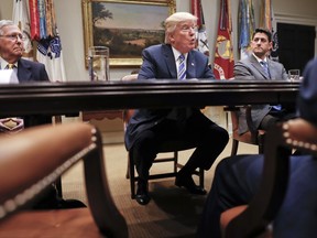 FILE - In this June 6, 2017 file photo, President Donald Trump, flanked by Senate Majority Leader Mitch McConnell of Ky., left, and House Speaker Paul Ryan of Wis., speaks in the Roosevelt Room of the White House in Washington. President Donald Trump resumed his taunts of his party's Senate leader, expressing disbelief that McConnell couldn't persuade a Republican majority to pass a health care bill.  (AP Photo/Pablo Martinez Monsivais, File)