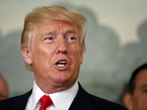 In this photo taken Aug. 14, 2017, President Donald Trump speaks in the Diplomatic Reception Room of the White House in Washington.