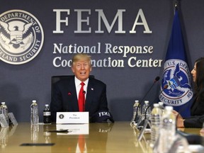 FILE - In this Aug. 4, 2017 file photo, President Donald Trump speaks at Federal Emergency Management Agency (FEMA) headquarters in Washington. The federal government has, for now, enough disaster aid money to deal with the immediate aftermath of Hurricane Harvey, but the ongoing storm appears sure to require a multibillion-dollar recovery package as did Hurricane Katrina and Superstorm Sandy. (AP Photo/Jacquelyn Martin, File)