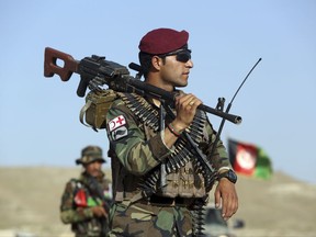Afghan National Army soldiers stand guard at a checkpoint on the outskirts of Kabul, Afghanistan, Monday, Aug. 21, 2017. Deep in the mountains of eastern Afghanistan, on the front lines against Taliban and Islamic State fighters, U.S. military commanders say they needs more forces to better train Afghan soldiers to combat the escalating threat. They're hoping President Donald trump heeds their calls when he outlines his new war strategy Monday.  (AP Photo/Rahmat Gul)