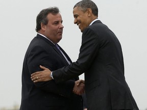 FILE - In this May 28, 2013 file photo, New Jersey Gov. Chris Christie greets President Barack Obama upon his arrival at McGuire Air Force Base, N.J. Obama traveled to New Jersey joining Christie to inspect and tour the Jersey Shore's recovery efforts from Hurricane Sandy. George W. Bush never recovered from his flyover of Hurricane Katrina's devastation. Obama got a bipartisan boost late in his re-election campaign for his handling of Superstorm Sandy. (AP Photo/Pablo Martinez Monsivais, File)