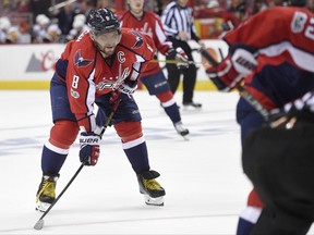 In this photo taken April 29, 2017, Washington Capitals left wing Alex Ovechkin (8), of Russia, looks on during the second period of Game 2 in an NHL hockey Stanley Cup second-round playoff series against the Pittsburgh Penguins, in Washington. The Russian superstar skated in an informal practice Tuesday, Aug. 29, 2017, and looked like he wasn't as heavy as when he played at 239 pounds last season. If that's indeed the case, Ovechkin took to heart the challenge from general manager Brian MacLellan to train differently and add more speed to his game as he's about to turn 32. (AP Photo/Nick Wass)