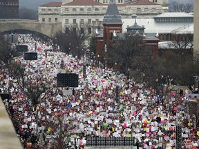 FILE - In this Jan. 21, 2017 file photo, a crowd fills Independence Avenue during the Women's March on Washington, in Washington. The resistance movement that flourished with Donald Trump's ascendance to the White House isn't necessarily itching to see his presidency undone by the investigation into Russia's election meddling or even impeachment.  (AP Photo/Alex Brandon, File)