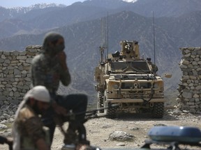 U.S. forces and Afghan security police are seen in Asad Khil near the site of a U.S. bombing in the Achin district of Jalalabad, east of Kabul, Afghanistan.