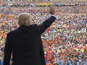 Donald Trump waves to the crowd after speaking at the 2017 National Scout Jamboree in Glen Jean, West Virginia in July. The Boy Scouts are denying a claim by President Donald Trump that the head of the youth organization called the president to praise his politically aggressive speech to the Scouts' national jamboree.