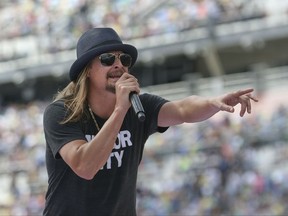 In this photo taken Feb. 22, 2015, singer Kid Rock performs a concert before the Daytona 500 auto race in Daytona Beach, Fla. Steven Law, the head of a super PAC aligned with Senate GOP leadership is encouraging performer Kid Rock to run for Senate against Democratic incumbent Debbie Stabenow of Michigan. (AP Photo/Reinhold Matay)