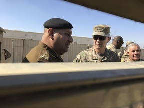 FILE - In this Feb. 8, 2-17 file photo, U.S. Army Lt. Gen. Stephen Townsend, center, speaks with an Iraqi officer during a tour north of Baghdad, Iraq. Senior U.S. commanders say Iraqi forces are largely set for their next major campaign against Islamic State extremists. Townsend, the top U.S. commander in Iraq, said he sees the Iraqi assault on the IS-held area of Tal Afar "unfolding relatively soon." (AP Photo/ Ali Abdul Hassan, File)