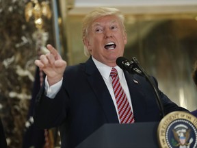 In this photo taken Aug. 15, 2017, President Donald Trump speaks to the media in the lobby of Trump Tower in New York. President Donald Trump's response to white supremacist violence in Virginia has left Democrats in a quandary. They want to seize the moral high ground, but without getting sucked into a politically risky culture war.  (AP Photo/Pablo Martinez Monsivais)