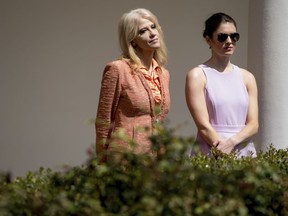 In this photo taken April 5, 2017, Hope Hicks, right, stands with Counselor to the President Kellyanne Conway at the colonnade of the White House in Washington. After four people tackled the assignment with limited success, the job of keeping President Donald Trump on message has now fallen to Hicks, a young former public relations aide and political neophyte who entered his orbit not knowing the ride would eventually take her into the cutthroat world of Washington politics. (AP Photo/Andrew Harnik)