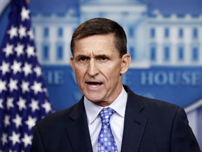 FILE - In this Feb. 1, 2017 file photo, then-National Security Adviser Michael Flynn speaks during the daily news briefing at the White House, in Washington. Flynn is detailing previously undisclosed paid speaking engagements, business positions and income from the presidential transition that he left off his public financial disclosure. A person close to Flynn tells The Associated Press that the filing shows Flynn entered into a consulting agreement with the British parent company of data firm Cambridge Analytica, which aided the Trump campaign. The person says Flynn didn't perform work or accept payment under the agreement. He terminated it after Trump's election victory. (AP Photo/Carolyn Kaster, File)