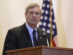 FILE - In this July 22, 2016, file photo, then-Agriculture Secretary Tom Vilsack speaks during a town hall on the opioid epidemic in Columbia, Mo. Dissatisfied with Democratic fortunes in the era of President Donald Trump, a group of prominent Democrats is forming an organization outside the formal party structure with the goal of winning again in Republican-dominated middle America. Calling itself "New Democracy," the group includes sitting and former governors, former Cabinet members, mayors and lawmakers from Congress to statehouses. Among the affiliated politicians: Colorado Gov. John Hickenlooper, considered a possible future presidential candidate; Vilsack; and Mayor Mitch Landrieu of New Orleans, current head of the nonpartisan U.S. Conference of Mayors. (AP Photo/Jeff Roberson, File)