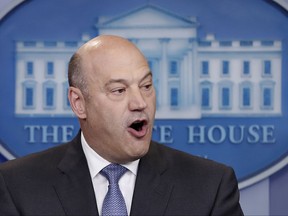 In this April 26, 2017 photo, National Economic Director Gary Cohn speaks in the briefing room of the White House, in Washington.  Cohn says he's under "enormous pressure" both to quit and remain in the White House and says the administration "must do better" in condemning hate groups after the violence at a white nationalist rally in Charlottesville, Virginia.  (AP Photo/Carolyn Kaster)