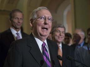 FILE - In this Aug. 1, 2017 file photo, Senate Majority Leader Mitch McConnell of Ky., flanked by Sen. John Thune, R-S.D., the Republican Conference chairman, left, and Sen. Roy Blunt, R-Mo., meets with reporters on Capitol Hill Washington. Republicans have little to show for their first seven months of controlling the White House and Capitol Hill. The Senate sent Justice Neil Gorsuch to the Supreme Court, and Congress passed bills bolstering veterans' health programs and financing the Food and Drug Administration. (AP Photo/J. Scott Applewhite, File)