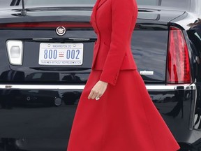In this photo taken July 13, 2017, first lady Melania Trump walks to her motorcade after arriving with President Donald Trump on Air Force One at Orly Airport south of Paris. As President Donald Trump's administration alters some parts of the former first lady's legacy, Mrs. Trump is keeping other parts of it alive, from public policy to high fashion to family ties. (AP Photo/Carolyn Kaster)
