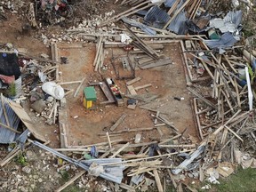 FILE - In this Oct. 14, 20-16 file photo, the remains of a destroyed home lay in southwestern Haitia week and a half after Hurricane Matthew devastated the region. A new U.S. report says last year's weather was far more extreme or record breaking than anything approaching normal. The National Oceanic and Atmospheric Administration on Thursday, Aug. 10, 2017, released its annual state of the climate 2016 report, highlighting numerous records including hottest year, highest sea level and lowest sea ice in the Arctic and Antarctica. (AP Photo/Rebecca Blackwell, File)