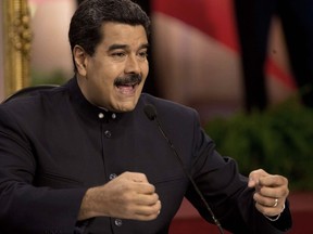 Venezuela's President Nicolas Maduro speaks at a news conference in Caracas, Venezuela, Tuesday, Aug. 22, 2017. Immigration authorities in Colombia announced that Venezuela's ousted chief prosecutor Luisa Ortega Diaz is on her way to Brazil. Ortega said that Maduro removed her in order to stop a probe linking him and his inner circle to nearly $100 million in bribes from Brazilian construction company Odebrecht. (AP Photo/Ariana Cubillos)