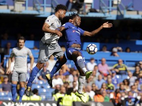 Chelsea's Willian, right, goes for the ball with Everton's Ashley Williams during the English Premier League soccer match between Chelsea and Everton at Stamford Bridge stadium in London, Sunday, Aug. 27, 2017. (AP Photo/Alastair Grant)