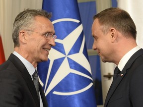 NATO Secretary General Jens Stoltenberg, left, and Polish President Andrzej Duda meet prior to official talks, in Warsaw, Poland, Thursday, Aug. 24, 2017. (AP Photo/Alik Keplicz)