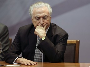 Brazil's President Michel Temer attends a ceremony to announce the creation of a new park and museum at the City Hall, in Sao Paulo, Brazil, Monday, Aug. 7, 2017. (AP Photo/Andre Penner)