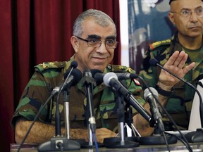 Brig. Gen. Ali Qanso, chief military spokesman, speaks during a press conference at the Lebanese Defense Ministry in Yarzeh near Beirut, Lebanon, Saturday, Aug. 19, 2017.