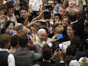Pope Francis arrives for his weekly general audience in Paul VI Hall at the Vatican, Wednesday, Aug. 23, 2017. (AP Photo/Gregorio Borgia)