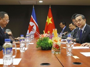 North Korean Foreign Minister Ri Yong Ho, second from left, prepares for a meeting with his Chinese counterpart Wang Yi, second from right, in the sidelines of the 50th ASEAN Foreign Ministers' Meeting and its Dialogue Partners Sunday, Aug. 6, 2017 in suburban Pasay city, south Manila, Philippines.