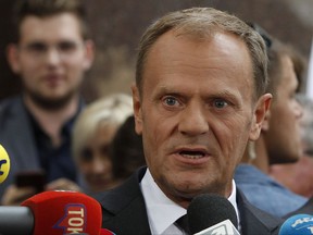 President of the European Council Donald Tusk speaks to the media outside the prosecutor's office in Warsaw, Poland, Thursday, Aug. 3, 2017.  Polish investigators questioned Donald Tusk as a witness Thursday in an investigation into the 2010 plane crash that killed President Lech Kaczynski -- a case widely seen as a politically-driven attempt to discredit the EU leader. (AP Photo/Czarek Sokolowski)