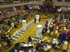 FILE - In this Tuesday, Aug. 8, 2017 file photo, members of parliament prepare to vote for or against the motion of no confidence against South African president, Jacob Zuma in the South African parliament in Cape Town, South Africa. South Africa's main opposition Democratic Alliance party submitted a motion to dissolve pariament Thursday, Aug. 10 2017 in a move that, if passed, would require fresh national elections. (Rodger Bosch/Pool Photo via AP, File)