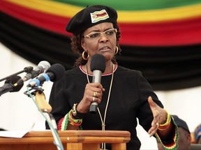 FILE -- In this Feb. 21, 2017 file photo, Zimbabwean first lady Grace Mugabe addresses party supporters at an event to mark her husband, Zimbabean Presdient Robert Mugabe's upcoming 93rd birthday in Harare, Zimbabwe. Mugabe has requested diplomatic immunity over an allegation that she assaulted a young model in Johannesburg earlier this week. (AP Photo/Tsvangirayi Mukwazhi, File)