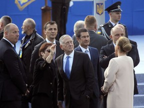 U.S. Defense Secretary Jim Mattis, center, attends a military parade to celebrate independence day in Kiev, Ukraine, Thursday, Aug. 24, 2017. The Ukraine officially declared itself independent from the Soviet Union on April 24, 1991. (AP Photo/Efrem Lukatsky)