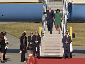 U.S. Vice President Mike Pence, left, and his wife Karen Pence arrive at Golubovci airport, near Podgorica, Montenegro, Tuesday, Aug. 1, 2017. Pence will attend the Adriatic Charter Summit in NATO's newest member, Montenegro, on Wednesday. (AP Photo/Risto Bozovic)