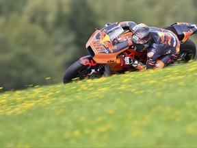 Finland's MotoGP rider Mika Kallio of the Red Bull KTM Factory Racing rides during a warm up session for the MotoGP race at the Austrian motorcycle Grand Prix at the Red Bull Ring in Spielberg, Austria, Sunday, Aug. 13, 2017. (AP Photo/Kerstin Joensson)