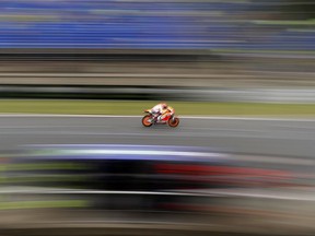 Spain's MotoGP rider Marc Marquez of the Repsol Honda Team rides during a warm up session for the MotoGP race at the Czech Republic motorcycle Grand Prix at the Automotodrom Brno, in Brno, Czech Republic, Sunday, Aug. 6, 2017. (AP Photo/Petr David Josek)