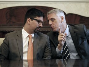 Argentine charge de affairs, Eduardo Porretti, right, speaks with Venezuelan National Assembly's Vice President Freddy Guevara during a meeting with the diplomatic corps in Caracas, Venezuela, Saturday, Aug. 19, 2017. Venezuela's pro-government constitutional assembly took over the powers of the opposition-led congress Friday, dramatically escalating a standoff between President Nicolas Maduro and his political foes.(AP Photo/Ariana Cubillos)