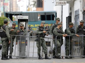 Venezuelan Bolivarian National Guards officers lineup outside of General Prosecutor headquarters in Caracas, Venezuela, Saturday, Aug. 5, 2017.